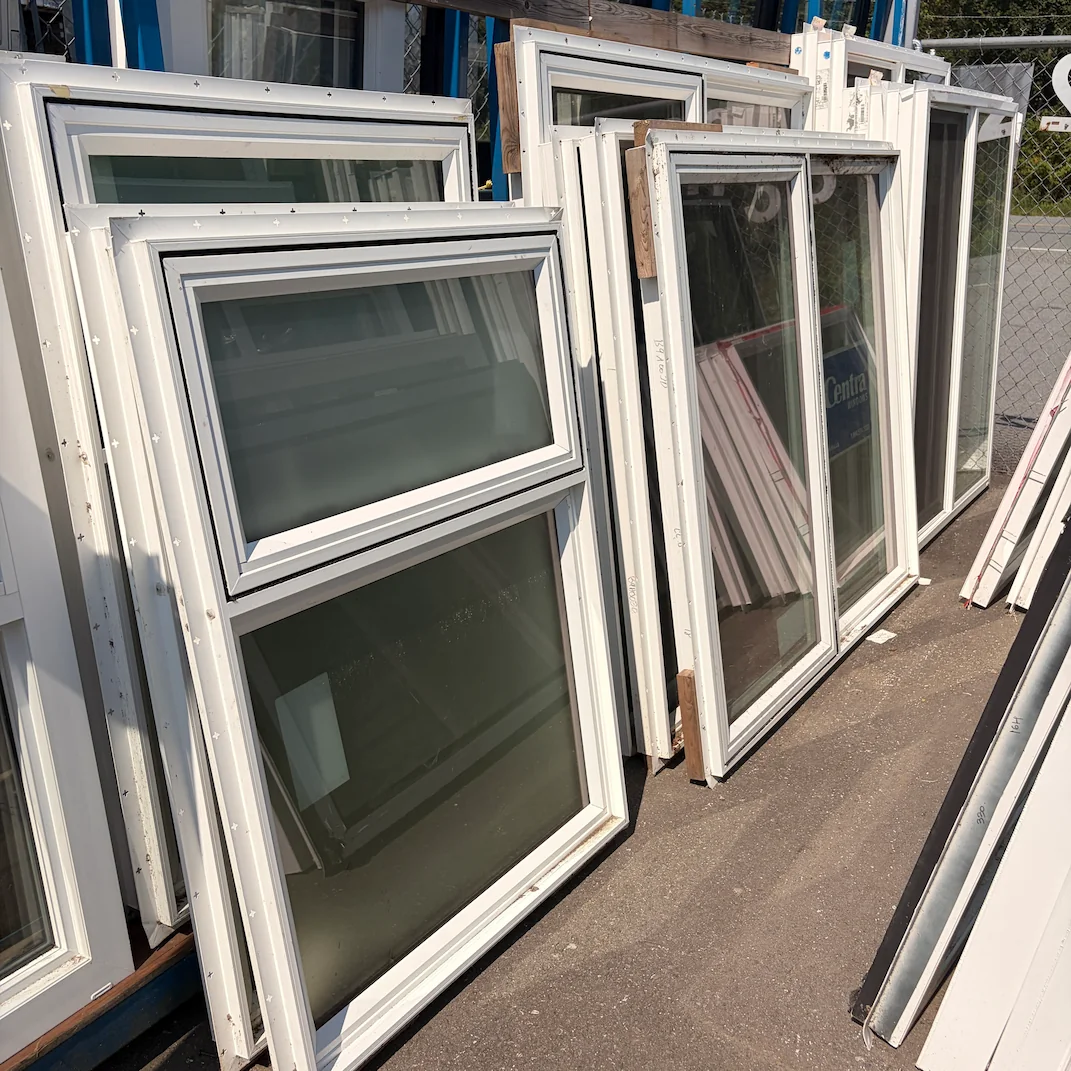 Selection of used vinyl windows available at MRNU